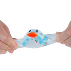 Hand holding a blue and white rubber duck toy on a white background