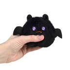 Squeezy Bead Plush Halloween — black bat plush being squeezed in hand