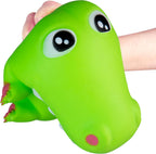 A bright green dinosaur head squishy toy being held by a person's hand against a plain white background.