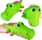 Green alligator-shaped toy with pink details on a white background