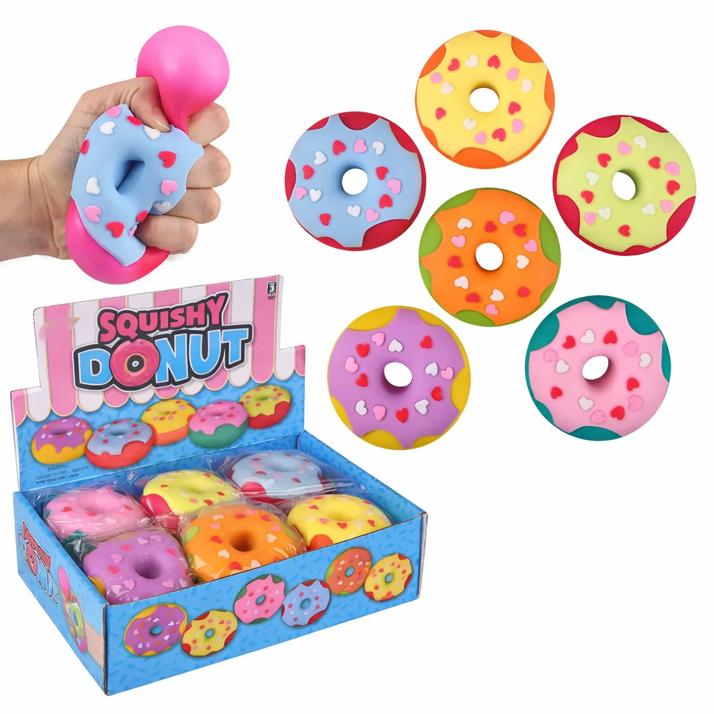 Colorful donut-shaped squishy toy with removable frosting and heart sprinkles on a white background