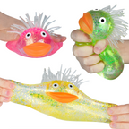 Three colorful fish-shaped stress relievers held by hands on a white background