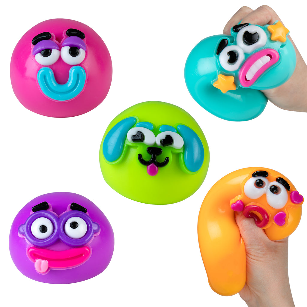 Colorful animal smushers with removable face designs held by hands on a white background