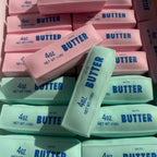 Stack of pink and blue butter bars with 'Butter' branding.