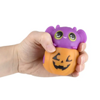 Squeezy Bead Jack-O-Lantern Bat — hand squeezing purple bat Halloween squishy toy