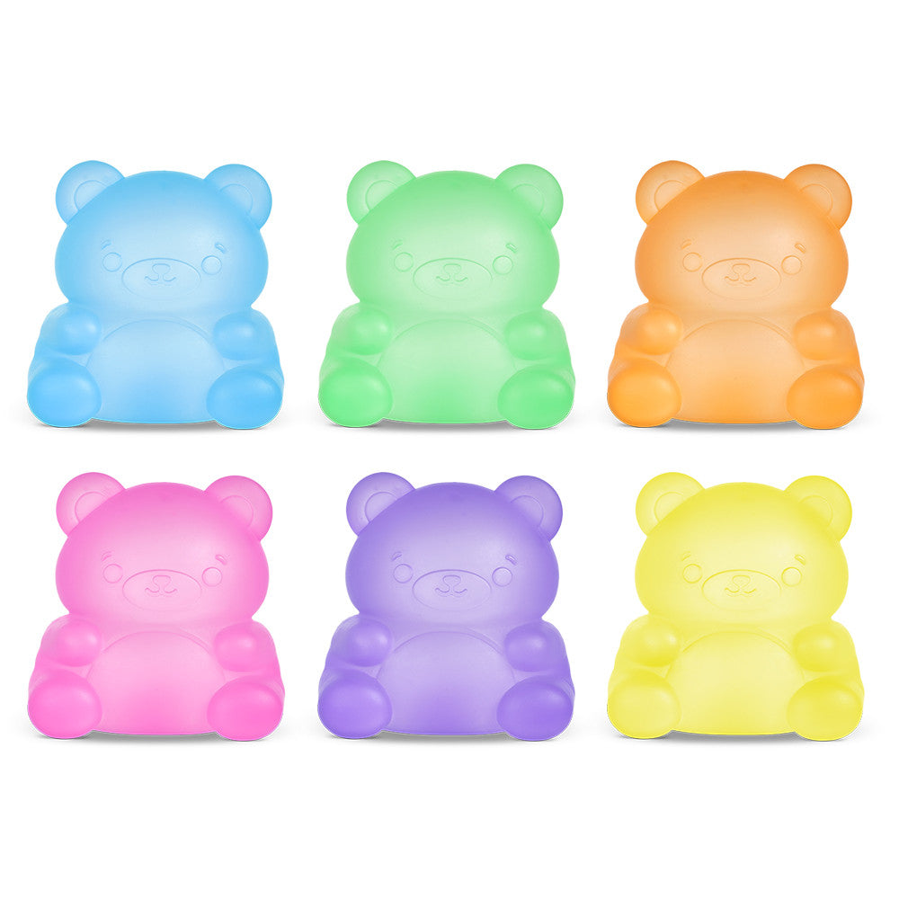 Set of six colorful bear-shaped squishies on a white background