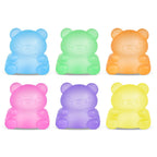 Set of six colorful bear-shaped squishies on a white background