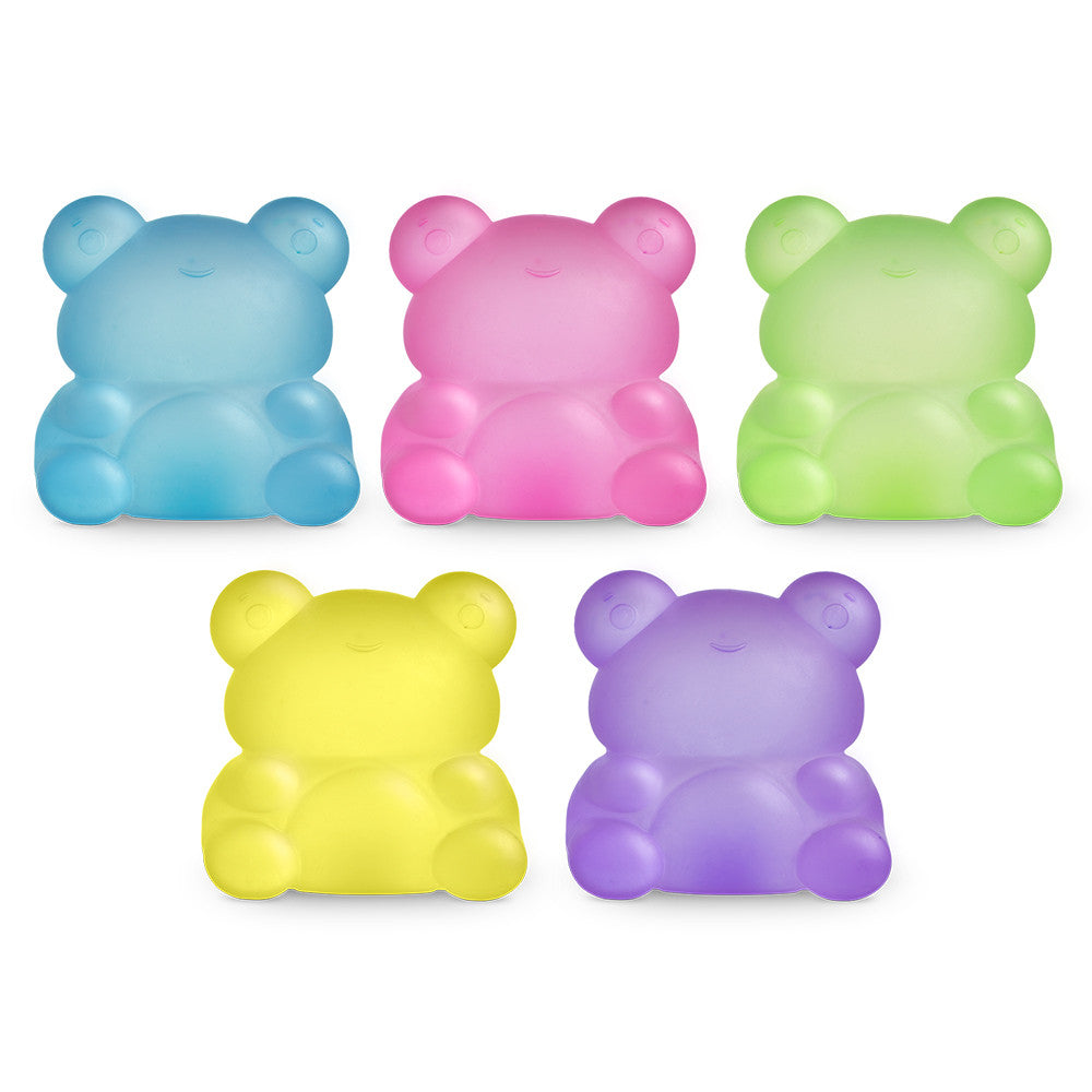 Five colorful bear-shaped objects on a white background