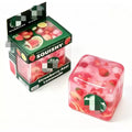 Pink squishy toy with strawberry and lemon design in packaging on a white background