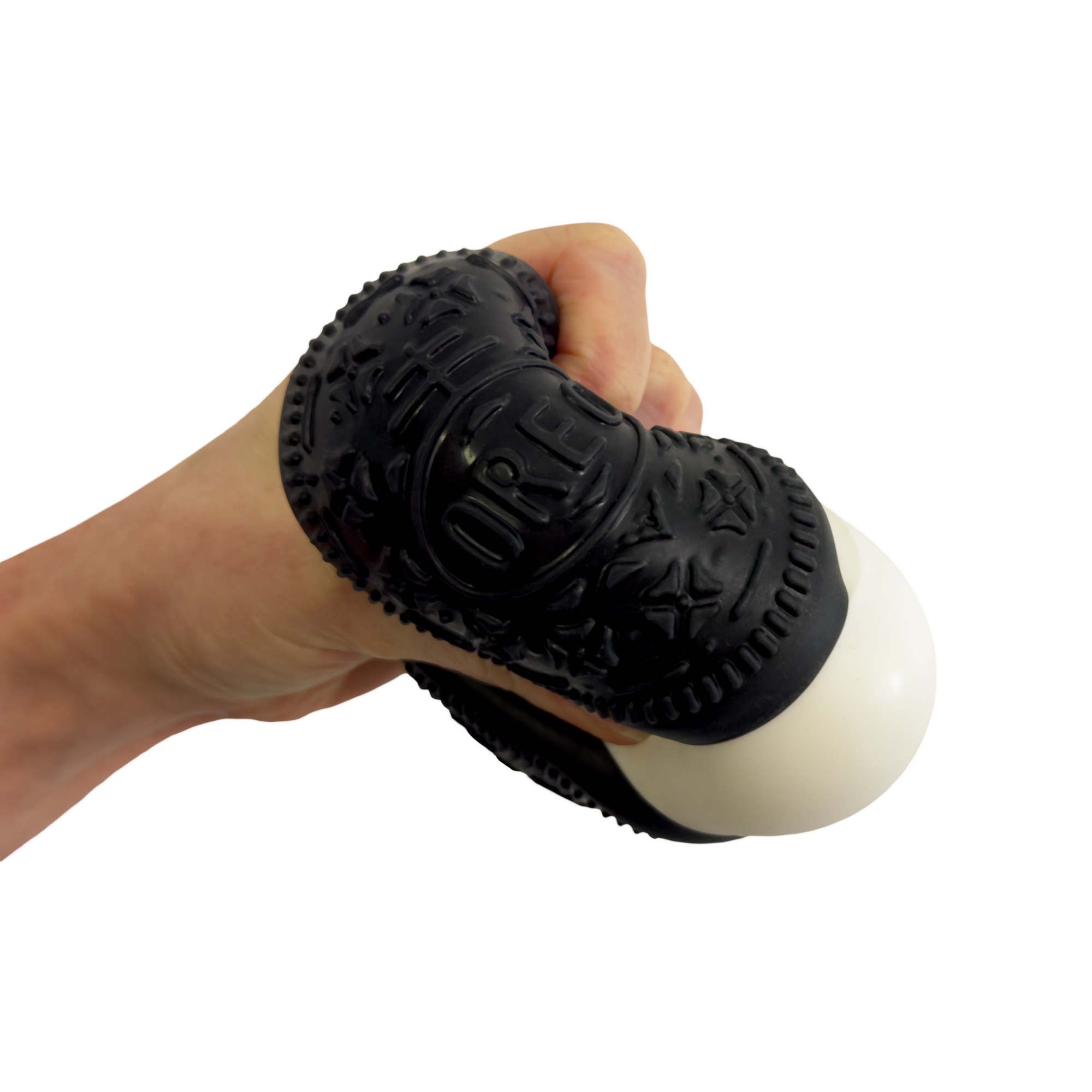 Hand holding a black massage tool with textured surface on a white background