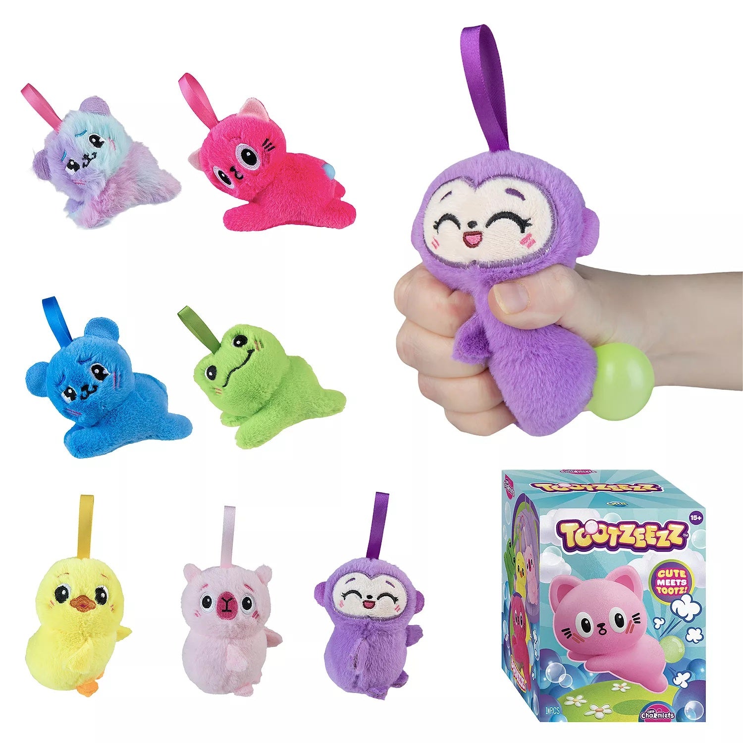 Colorful plush toys with a hand holding one, and a box of the toy set on a white background.