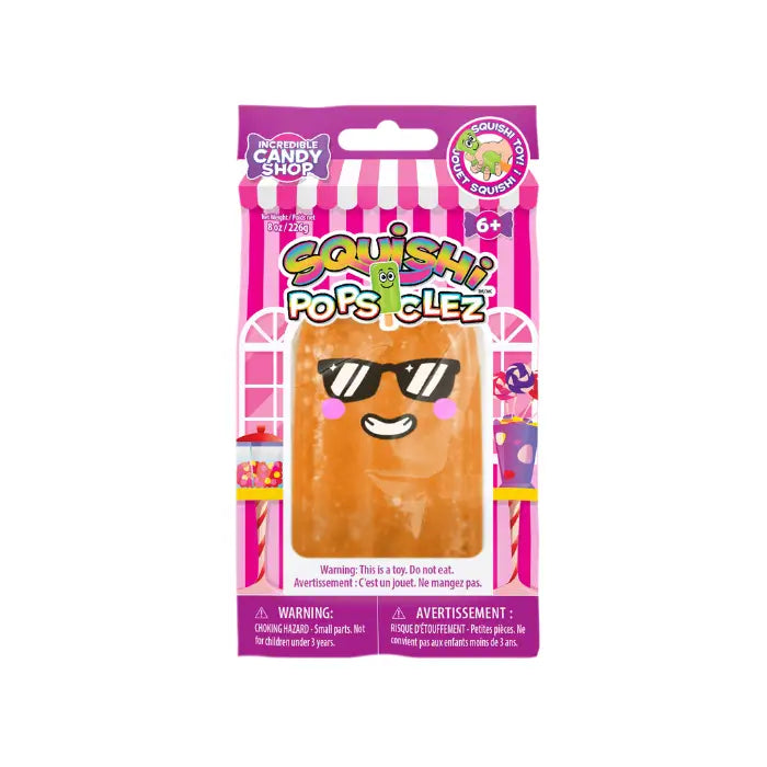 A packaged Squishy Popsiclez popsicle toy in its original retail packaging, featuring a brown popsicle with black sunglasses on a pink and white striped background.
