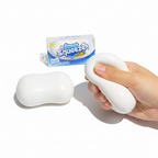 Soap squeeze toy next to Squeezer packaging, one being squeezed