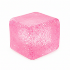 Pink glitter squishy cube sensory stress toy with sparkly glitter inside, white background