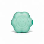 Teal daisy squishy toy with smiley face on white background