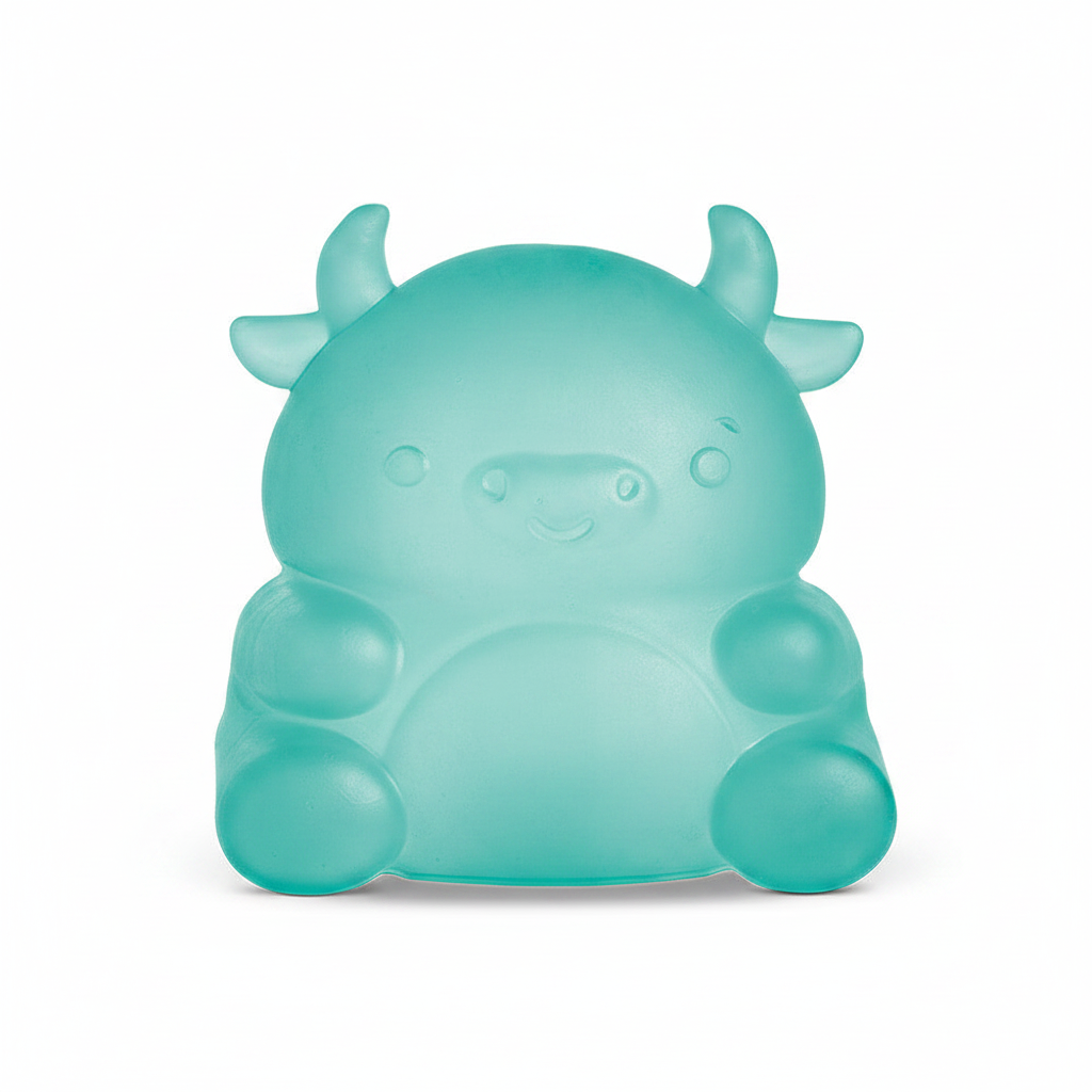 Teal cow squishy toy on white background