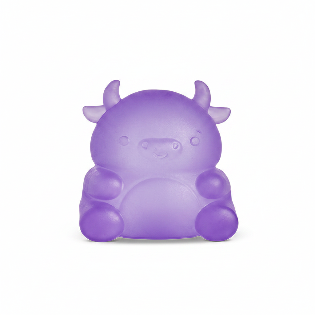 Purple cow squishy toy on white background