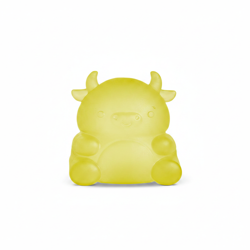Yellow cow squishy toy on white background
