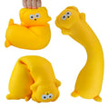 Yellow squishy toy with a face on a white background